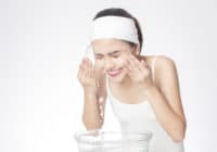 Beautiful woman is washing her face